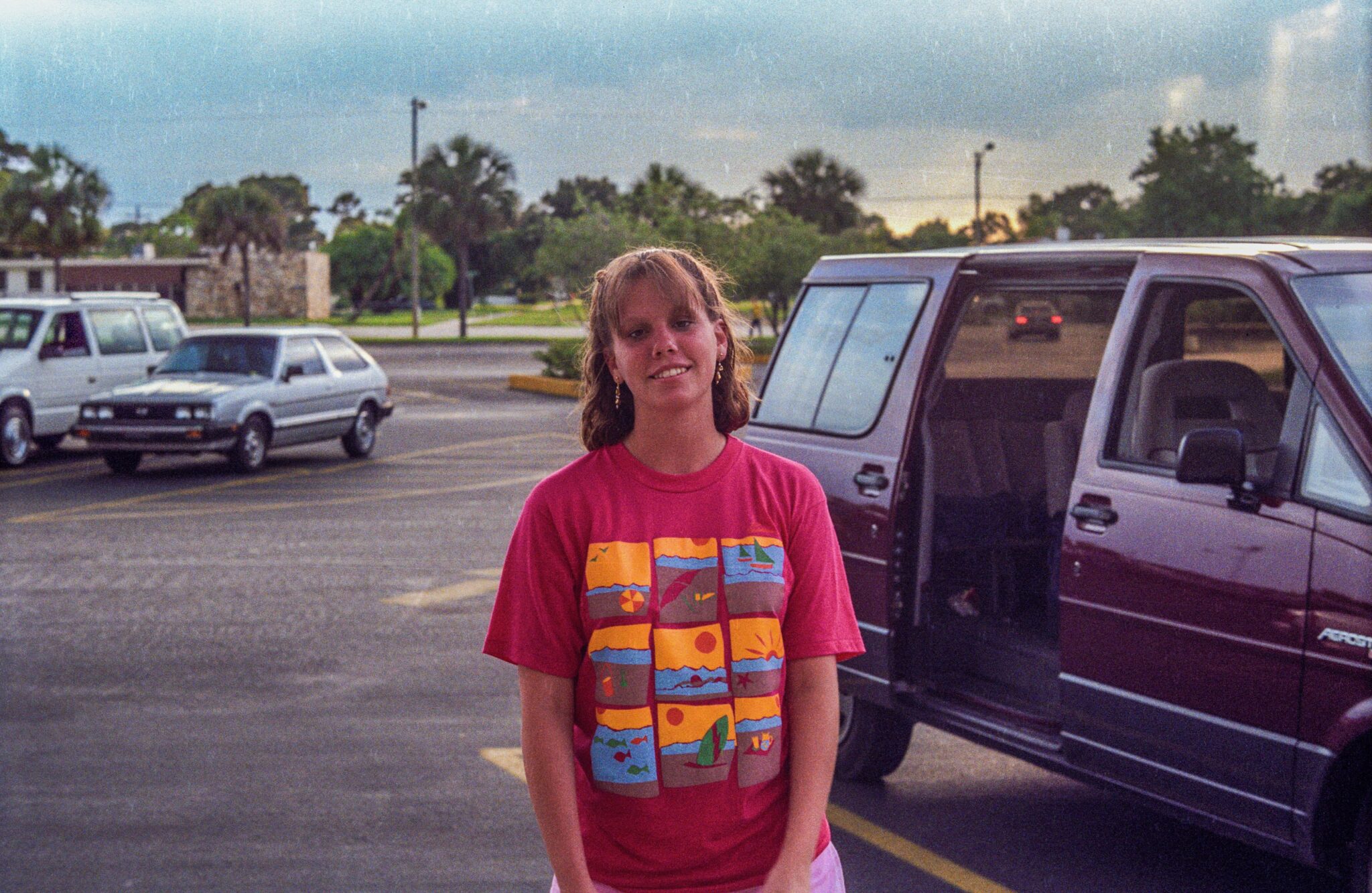 Annie Papke stands in front of Aerostar minivan
